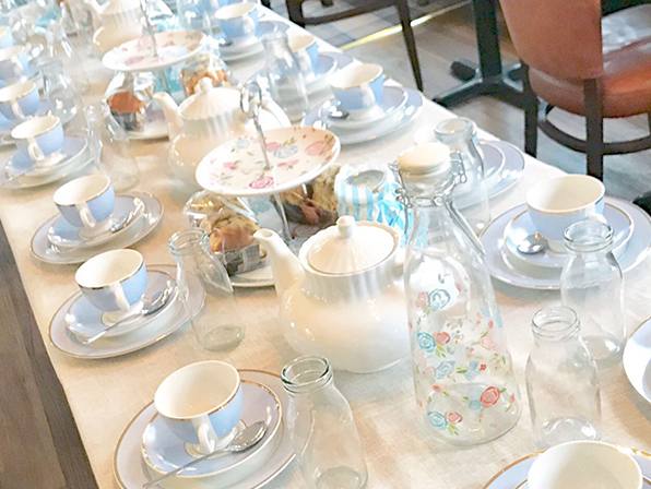 A table laid for afternoon tea with vintage china