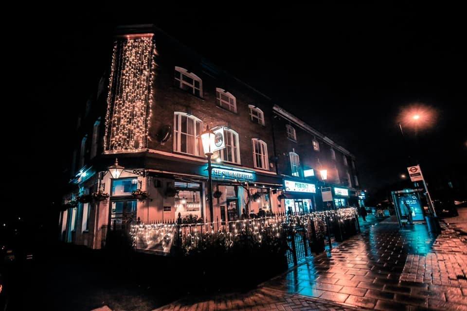 The pub lit up at night